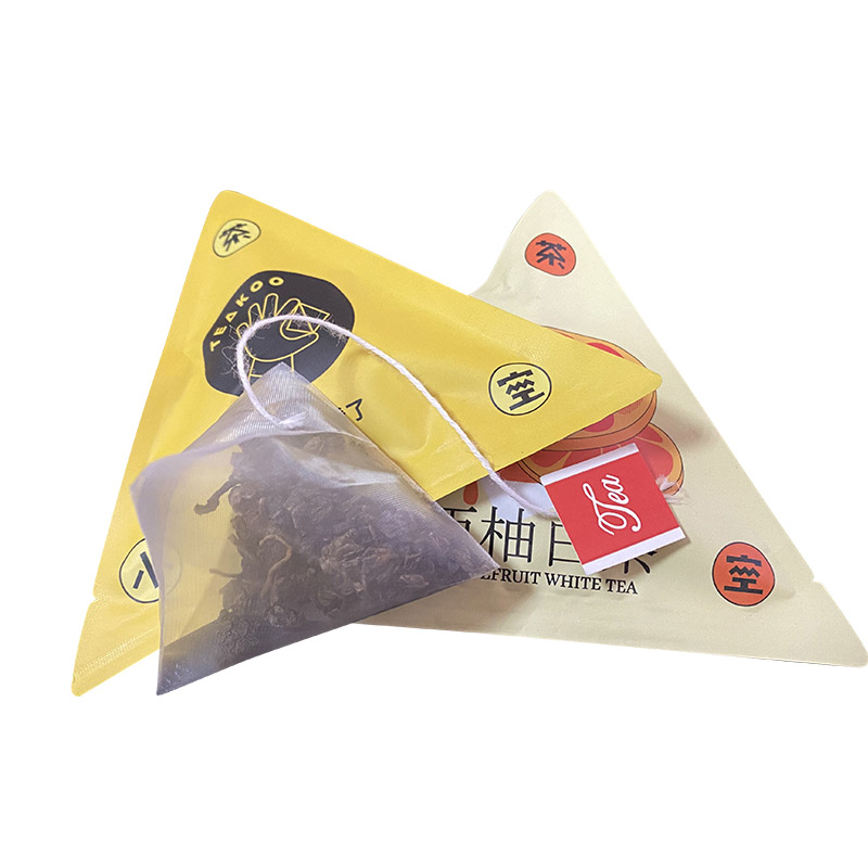Mesin pembungkusan beg Piramid teh sihat PLA dengan beg luar prabuatan dihantar ke Eropah